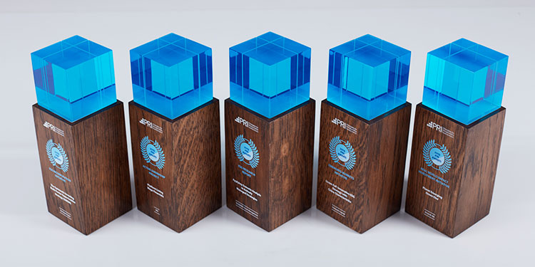 Engraved wooden awards, clear blue cap