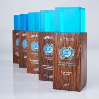 Line of PRI wooden column trophies with blue acrylic